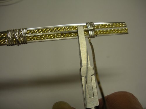 Judy Larson's Two-tone Beaded Bangle - , Classic Wire Jewelry, Wire Wrapping, Wrapping, Wire Wrapping Jewelry, Make three full wraps to show on the BACK side of the back of the bangle. Do not pull the beginning wire tail to the back yet.